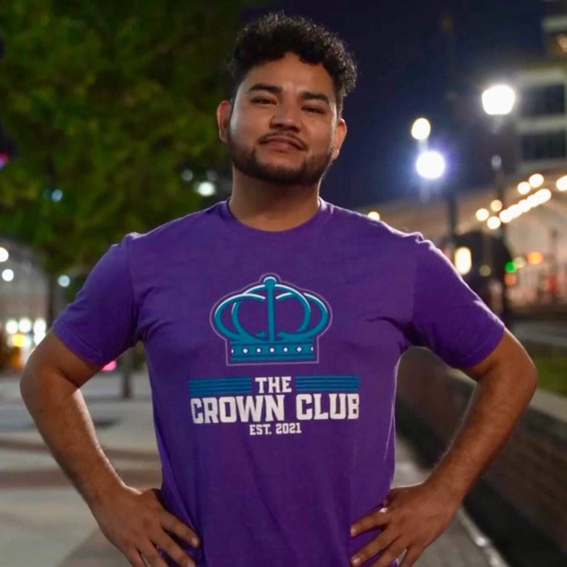 A Crown Club member repping the purple crown shirt
