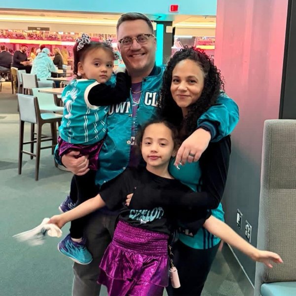 Scotty Kent with his family at a Hornets game
